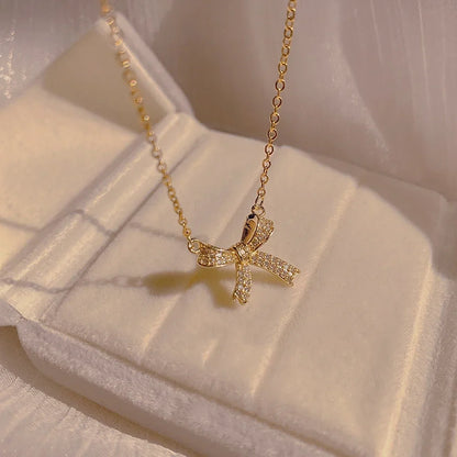Exquisite Copper Inlaid Zirconia Bow Pendant Necklace for Women